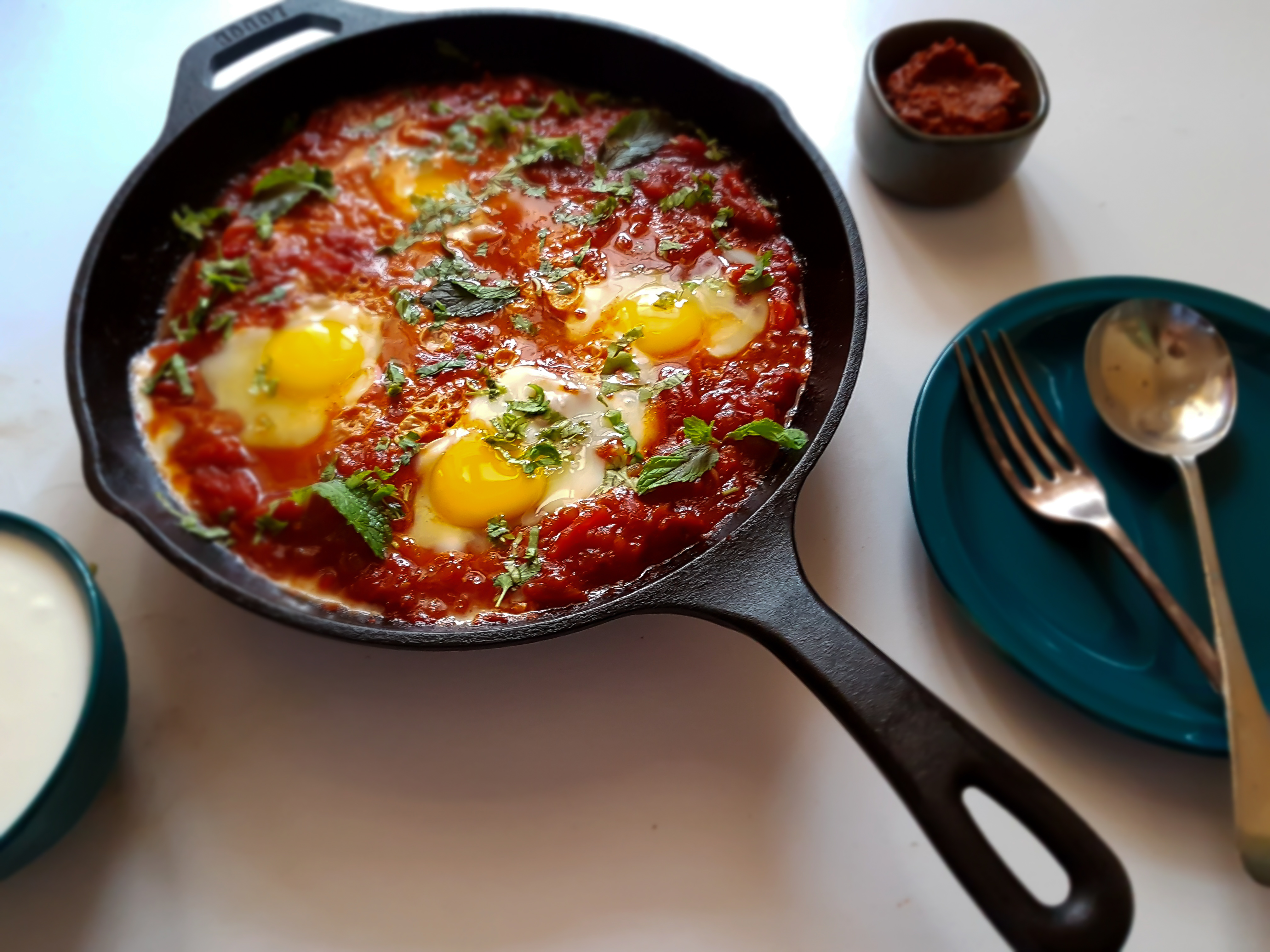 Shakshuka is saucy, spicy with poached eggs makes a perfect breakfast